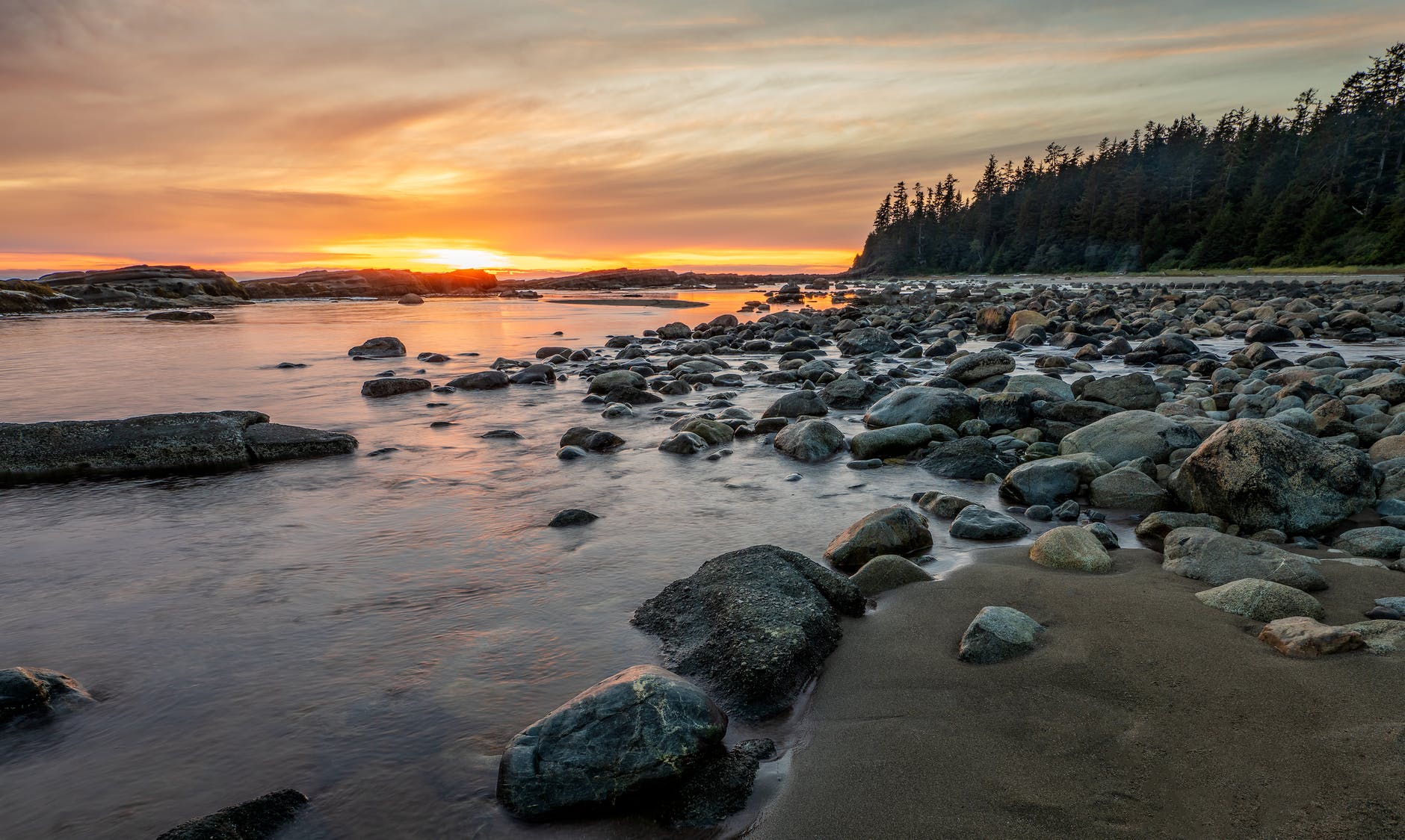 rocky shore with rocks on the shore during sunset