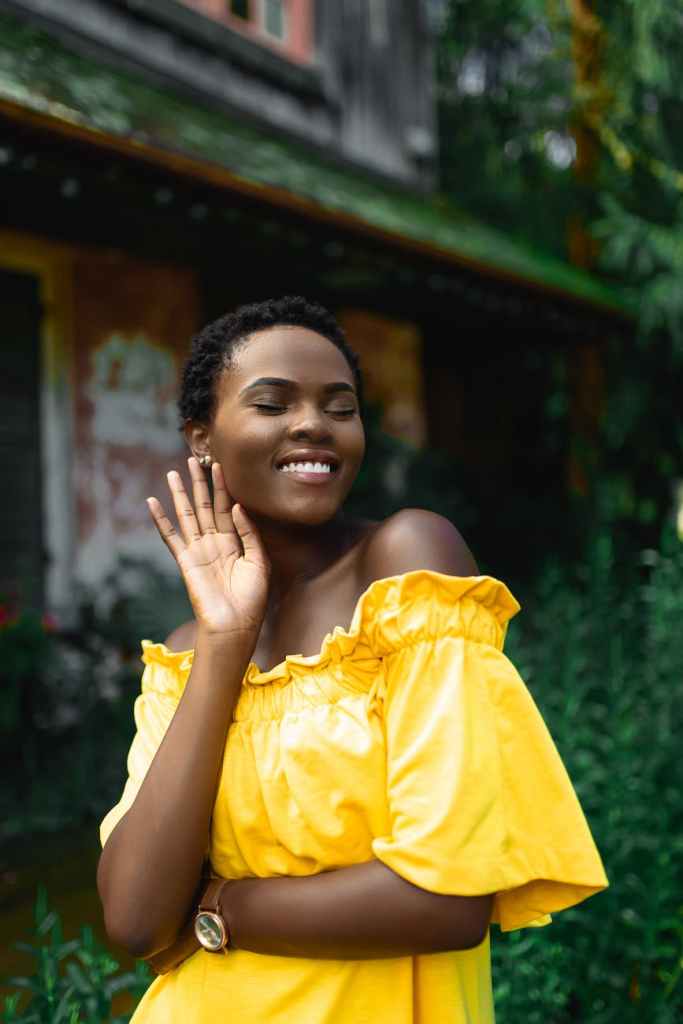 Women in yellow listening and smiling