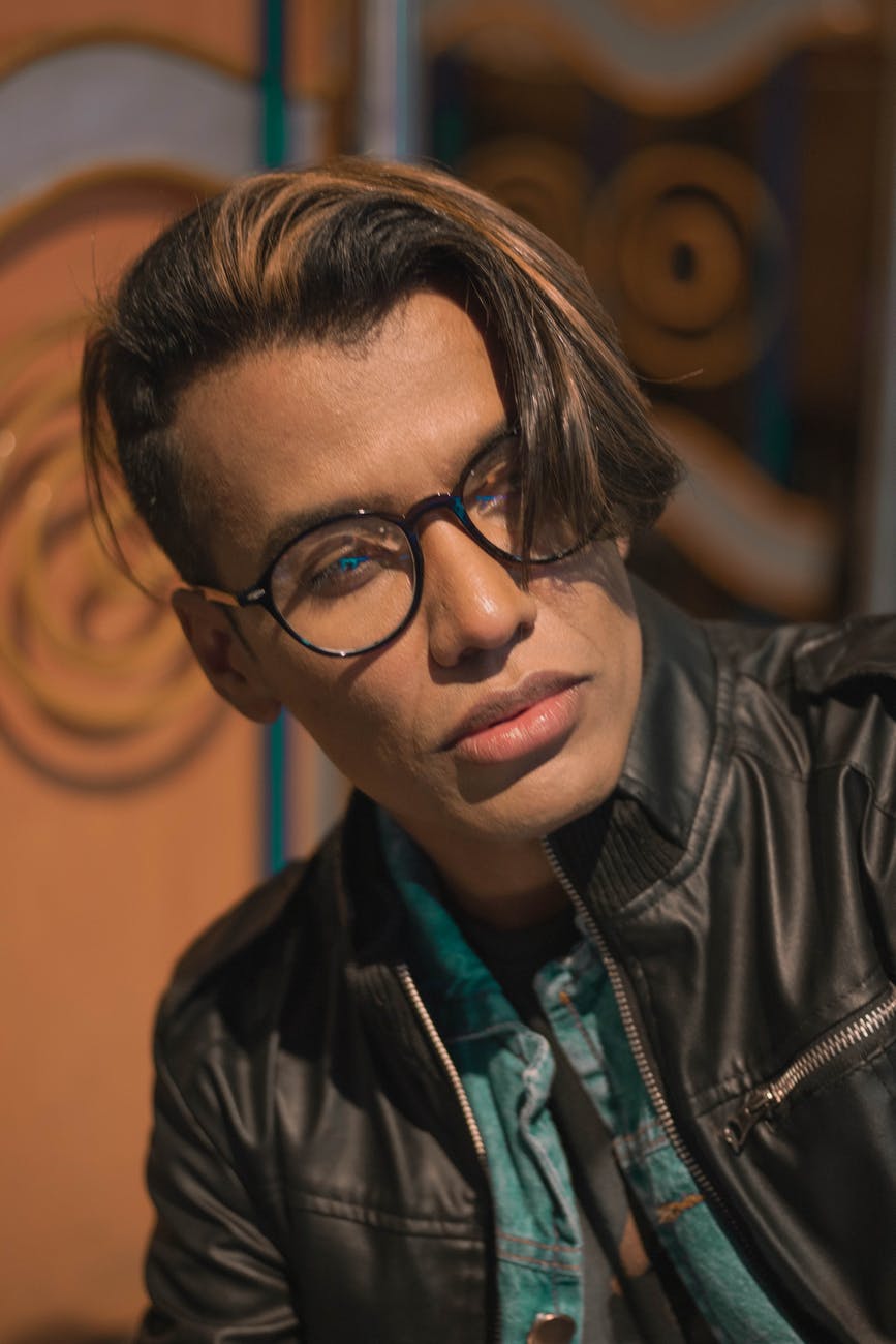 close up photo of man wearing eyeglasses